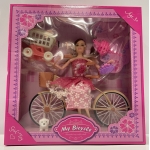 68-26 DOLL ON BICYCLE - Image 1